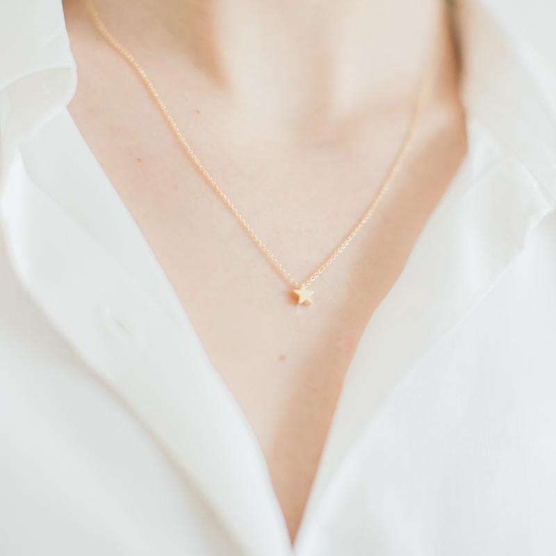 Small gold star on sale necklace